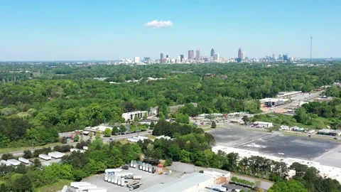 Atlanta skyline on the horizon while flying over industrial parks Stock Footage 153607243