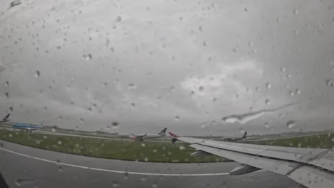 Atlantic Airways airplane taking off in rainy weather view through window Stock Footage 340320587
