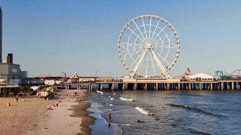 Atlantic City, New Jersey with Ferris Wheel, beachfront and the boardwalk Stock Footage