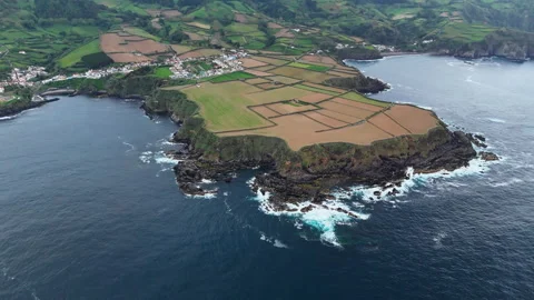 Atlantic coastal cliffs with patchwork fields and village, Azores Stock-Footage 335985384