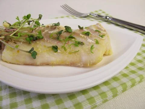 Atlantic cod fillet and shoot vegetables Foto stock