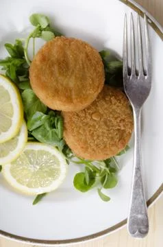 Atlantic cod fishcake with salad Stock Photos