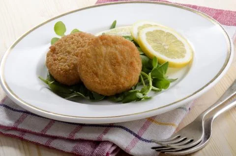 Atlantic cod fishcake with salad Stock Photos