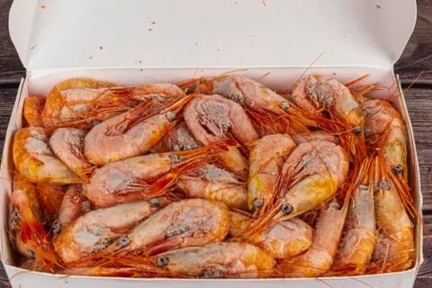 Atlantic frozen prawns in blocks on the table Stock Photos