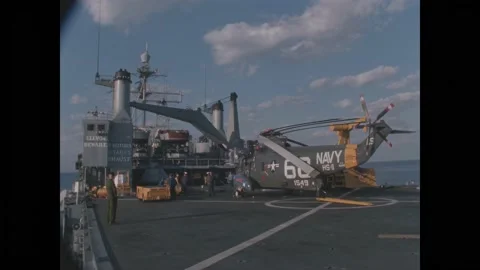 ATLANTIC OCEAN - 1967 - US Navy helicopters are maneuvered on the flight deck of Video stock 313053264