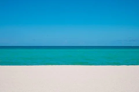 Atlantic Ocean and beach background. Miami Florida Beach. Summer vacation. Stock Photos