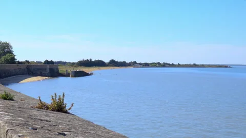 Atlantic ocean and beach of Le Chateau d'Oleron with tourists on a sunny day Stock Footage 278510669