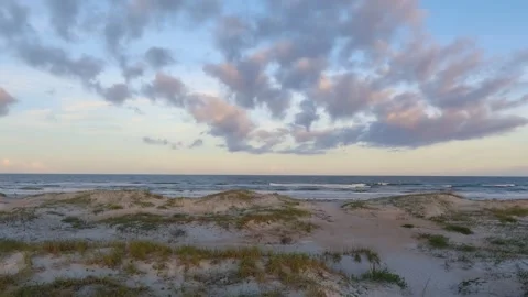 Atlantic Ocean Dunes, Waves and Whispy Clouds in an Afternoon Sky Video stock 297303182