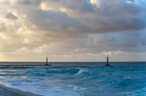 Atlantic ocean in the rays of the sun, clouds with light breaking through the Stock Photos