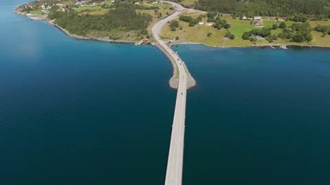 Atlantic Ocean Road bridge across Fjord with clear blue and turquoise sea Stock Footage 287976590