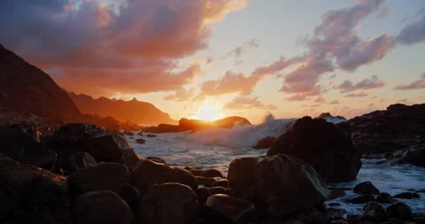Atlantic Ocean sunset. Scenic ocean rocky volcanic beach. Sea waves splashing on Stock Footage 198045002