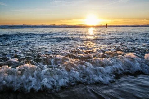 Atlantic ocean sunset with surging waves at Fonte da Telha beach, Portugal Stock Photos