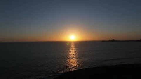 Atlantic Ocean Sunset with Tranquil Waters and Far Pier Gran Canaria Stock Footage 309940427