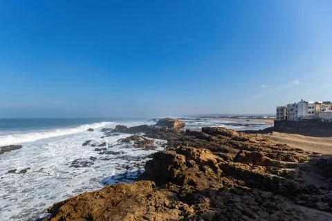 Atlantic ocean view with big waves and cliffs from Essaouira town Morocco Stock Photos