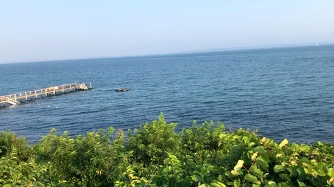 Atlantic Ocean View off coast of Marthas Vineyard, dock in distance Stock Footage 96086559