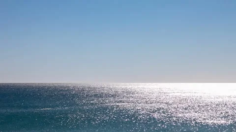 Atlantic Ocean water shimmering, glittering and sparkling on a calm summer day Stock Footage