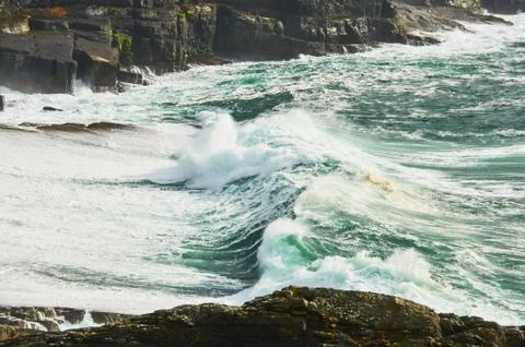 Atlantic Ocean Waves Cliffs of Kilkee in Ireland county Clare. Tourist destin Stock Photos