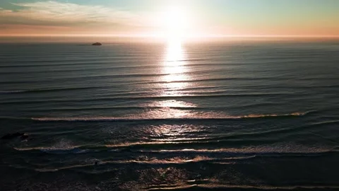 Atlantic Ocean waves with glowing sunset reflection aerial footage Stock Footage 330879554