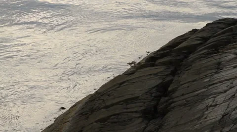Atlantic Ocean waves lap against rock Stock Footage 27516027