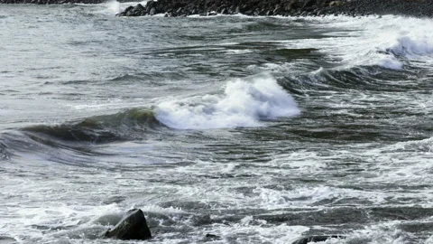 Atlantic Ocean waves on a rocky beach on São Jorge island in the Azores Stock Footage 230287672