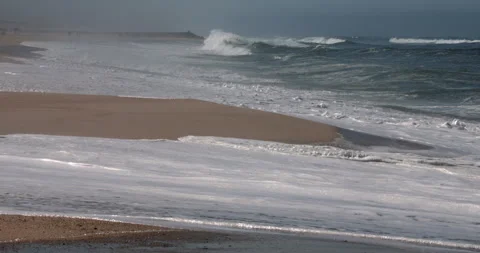 Atlantic Ocean Waves Rolling onto a Sandy Beach in Portugal Stock-Footage 346055281