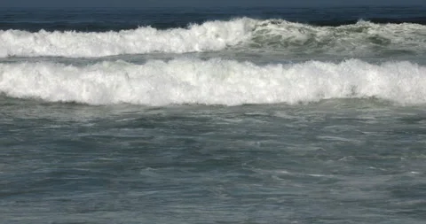 Atlantic Ocean Waves Rolling onto a Sandy Beach in Portugal Stock Footage 346055286