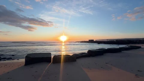 Atlantic Sunset Over Beach and Stone Blocks Stock-Footage 330875511