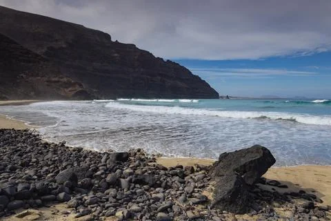 Atlantic waves approaching the volcanic shore at Orzola Stock Photos
