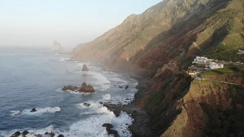 Atlantic waves on the background of mountains and sunset on island Stock Footage 105010699
