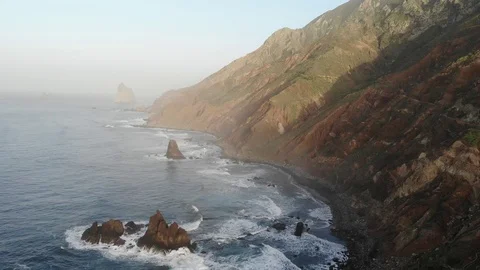 Atlantic waves on the background of mountains and sunset on island Video stock 105010956