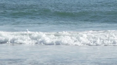 Atlantic waves breaking on sandy beach midclose no sky Stock Footage