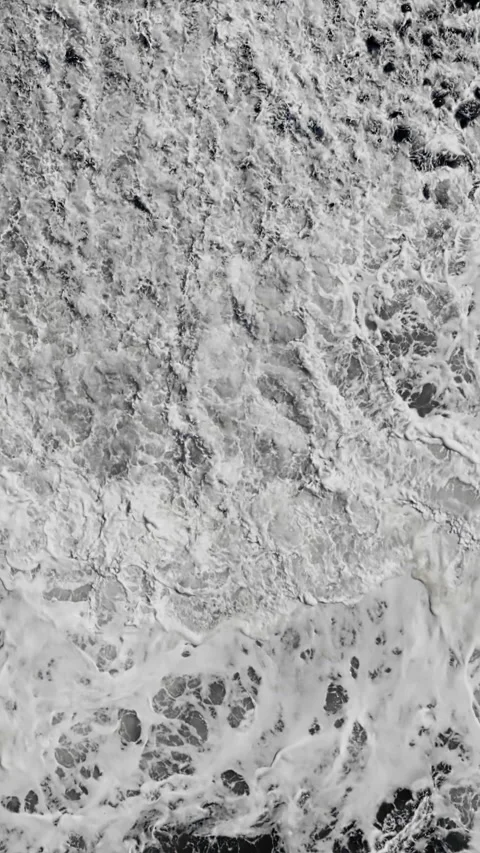 Atlantic waves crashing onto rocky pebble coast Stock Footage 340078665