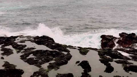 Atlantic waves hitting volcanic rocks Sao Miguel Azores Portugal Stock Footage 330966665
