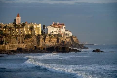 Atlantic waves rolling toward Estoril coastline at dusk Foto stock