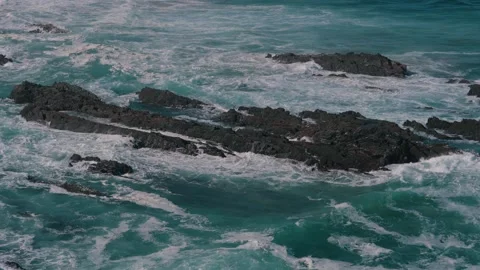 Atlantic waves washing over a dark rocky reef, Cabo Sardao, Portugal Stock Footage 346479858