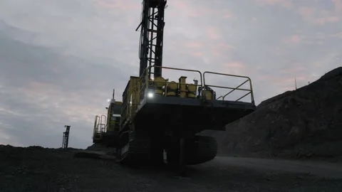 Atlas Copco DML HP drilling rig working in an open pit. Gold mining Stock Footage 168651629