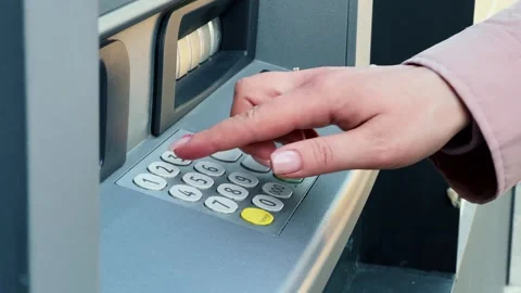 ATM Banking. Enter pin code in cash machine. Close up of person typing personal Stock Footage 275538806