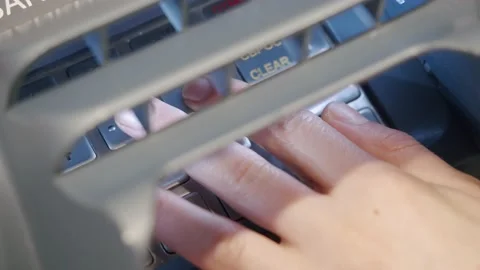 ATM Banking Hand Enter Pin Code In Cash Machine behind the bars covering the Stock Footage 142927259