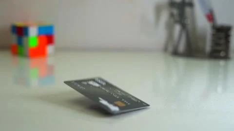Atm card  falling down closeup view Stock Footage 231272404