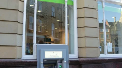 ATM Cash machine outside high street branch of Lloyds Bank Stock Footage 172244533
