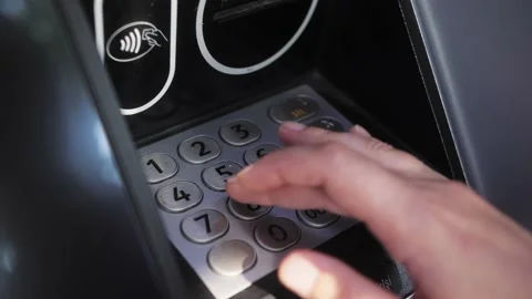 ATM concept. Enter pin code in cash machine. Close up of typing personal pin Stock Footage 220828012