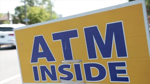 Atm inside sign in black writing on yellow background with bright background Stock-Footage 249100904