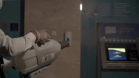 Atm machine and man. cleaning covid 19 Stock Footage 128840634