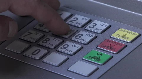 Atm machine close up hand entering pin number Stock Footage 57659130