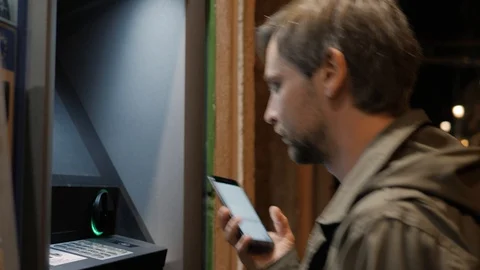 Atm machine close up hand entering pin number. Close up of the hand of man Stock Footage 98604332