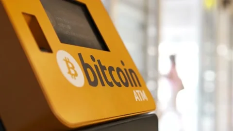 ATM machine for payment by Bitcoin cryptocurrency Stock Footage 199999589
