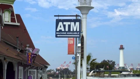 ATM Sign With Lighthouse in the Background Stock Footage 157791831