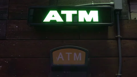 An ATM sign lit up at night. Stock Footage 138786332