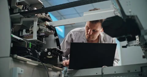 ATM Technician Setting ATM Machine Using Laptop Computer Stock Footage 309314814