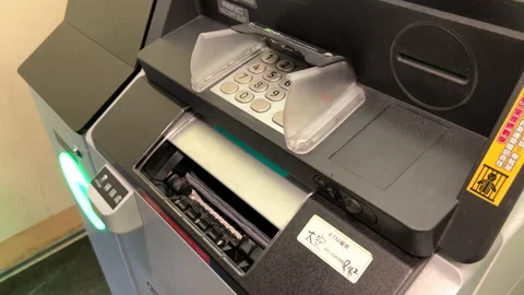 ATM Transaction Highlight: Man Retrieving Cash at Withdrawal Slot Stock-Footage 296174091